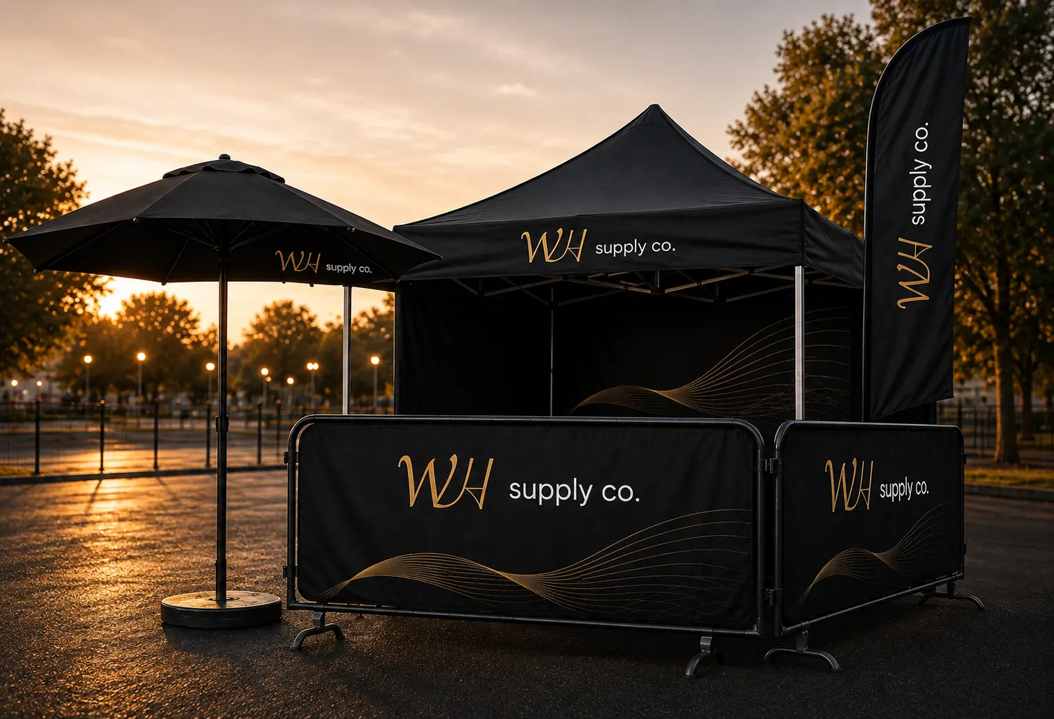 Branded event tent with flags, display stand, promotional materials and clothing